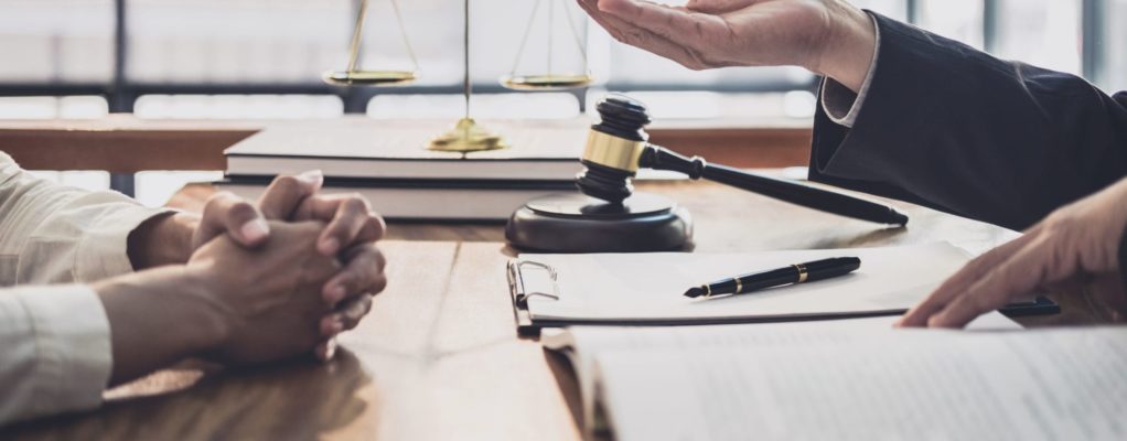 Two people meet in a legal setting