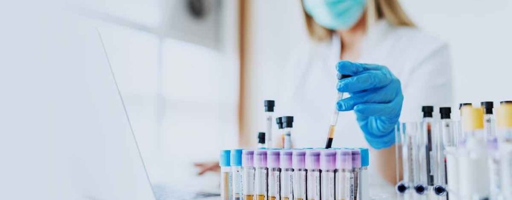 Doctor conducting cancer research in a lab.