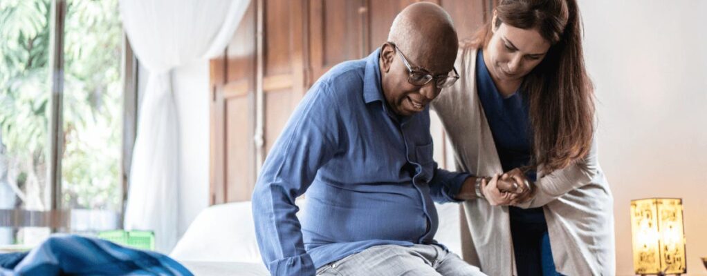 Nurse helping elderly patient