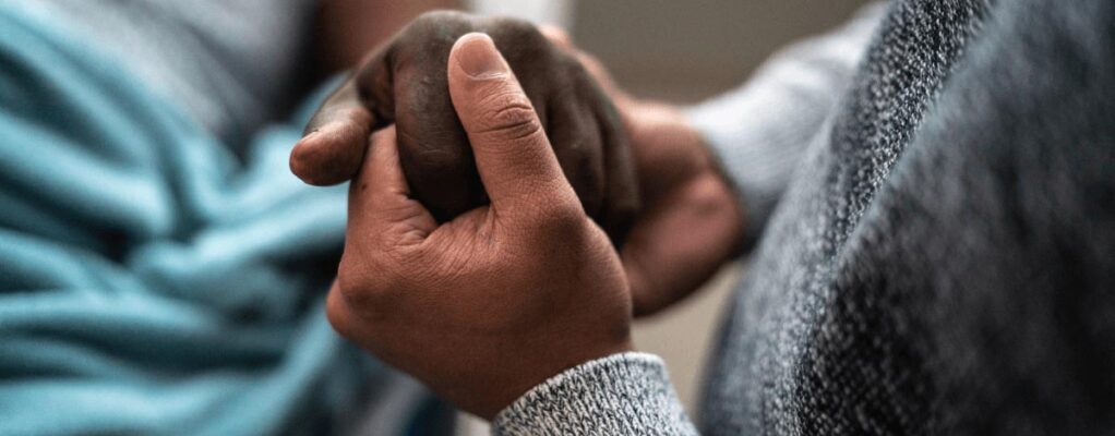 two people holding hands